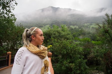 Beautiful young contemplative woman in a forestの写真素材
