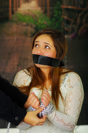 Terrified young girl kidnapped and bondedの写真素材