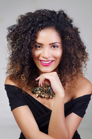 exotic beautiful young girl with dark curly hairの写真素材