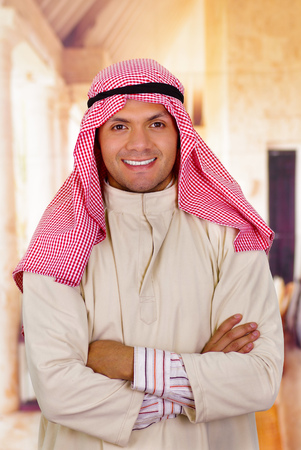 smiling arabian man with arms crossedの写真素材