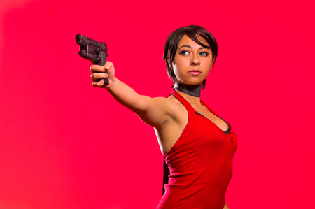 Powerful Woman Holding a gun, resident evil cosplay costumeの写真素材