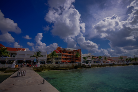 COZUMEL, MEXICO - MARCH 23, 2017: Beautiful vacation resort of Cozumel with some natural buildings, gorgeous blue ocean and skyのeditorial素材