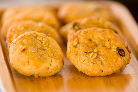 Freshly baked chocolate chip cookies on tray rackの写真素材