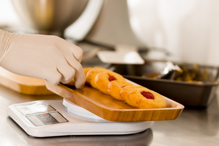 preparing delicious christmas cookies in a bakery storeの写真素材