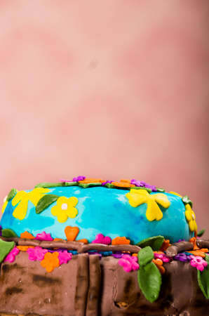 Tasty cake with beautiful colorful decorations sitting on table, piank wallpaper background, pastry conceptの写真素材