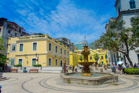 MACAU, CHINA- MAY 11, 2017: An unidentified people walking around in a beautiful parks with Sinks...