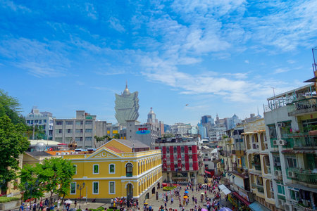 MACAU, CHINA- MAY 11, 2017: Macau city with buildings and behind the iconic hotel Grand Lisboa is a...
