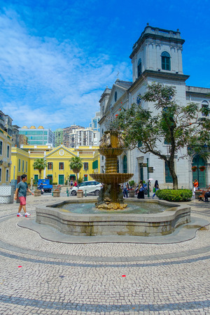 MACAU, CHINA- MAY 11, 2017: An unidentified people walking around in a beautiful parks with Sinks and seas horses in city center of Macau china in a gorgeous blue sky, beautiful dayのeditorial素材