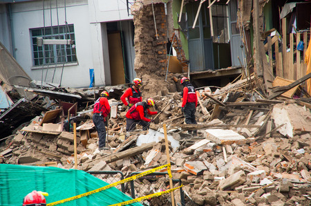 Quito, Ecuador - December 09, 2016: An unidentified group of firemans, Damage and destruction in building After Fire Infernoのeditorial素材
