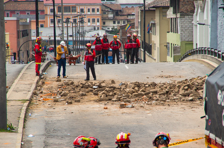 Quito, Ecuador - December 09, 2016: An unidentified group of firemans watching the damage and destruction in building After Fire Infernoのeditorial素材