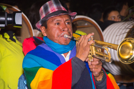 Quito, Ecuador - february 02, 2016: An unidentified man playing his instrument during popular town celebrationsのeditorial素材