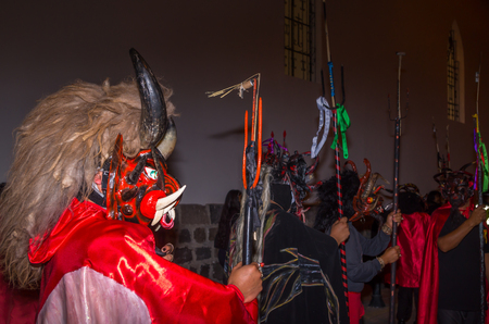 Quito, Ecuador - May 27, 2015: An unidentified group of people dressed up as devil in the diabladaのeditorial素材