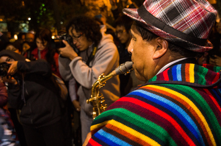 Quito, Ecuador - february 02, 2016: An unidentified man playing his instrument during popular town celebrationsのeditorial素材