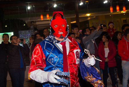 Quito, Ecuador - february 02, 2016: An unidentified people dressed up participating in the Diablada, popular town celebrations with people dressed as devils dancing in the streetsのeditorial素材