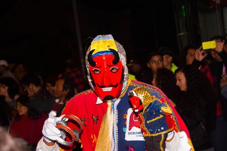 Quito, Ecuador - february 02, 2016: An unidentified people dressed up participating in the Diablada, popular town celebrations with people dressed as devils dancing in the streetsのeditorial素材