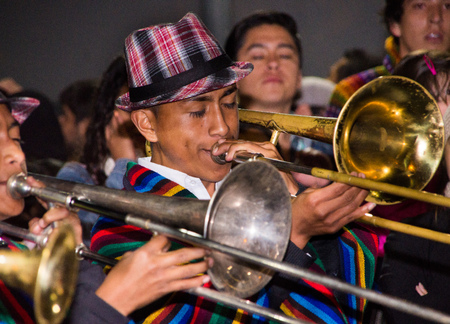 Quito, Ecuador - february 02, 2016: An unidentified people is playing his instrument during popular town celebrationsのeditorial素材