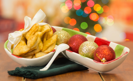Delicious ecuadorian pristinos piled up in bowl, traditional andean pastry, fruit platter sitting besidesの写真素材