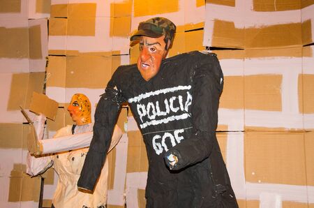 Quito, Ecuador - December 31, 2016: Traditional monigotes or stuffed dummies representing political figures, anime or famous cartoons, with a short description that will get burned to celebrate new year in Ecuadorのeditorial素材