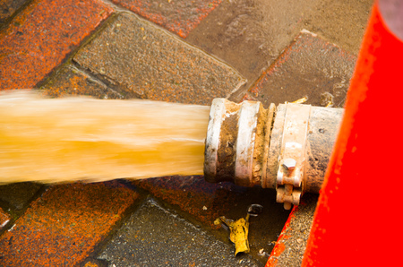 QUITO, ECUADOR - SEPTEMBER 20, 2016: Close up of a water pumping equipment from a flooded road in Quito city after a heavy rainのeditorial素材