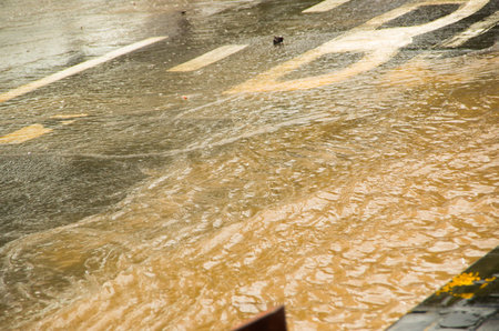 QUITO, ECUADOR - SEPTEMBER 20, 2016: Close up of a flooded road in Quito city after a heavy rain