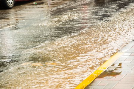 QUITO, ECUADOR - SEPTEMBER 20, 2016: Close up of a flooded road in Quito city after a heavy rainのeditorial素材