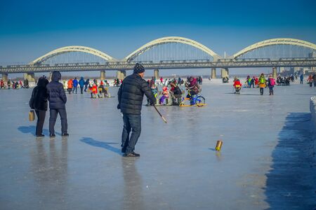 Harbin, China - February 9, 2017: Spinning top on ice on frozen river Songhua during winter time.のeditorial素材