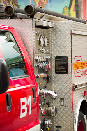 Quito, Ecuador - December 09, 2016: Closeup of a fire truck parking in the streetss of Quito
