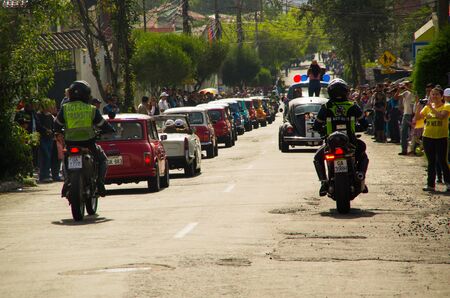 Quito, Ecuador - May 06, 2017: A parade of a group of cars before start the wood car racing inside of the streets of Quito cityのeditorial素材