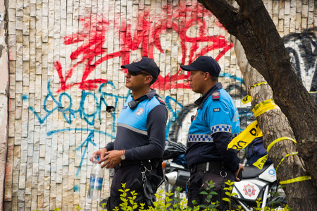 Quito, Ecuador - December 09, 2016: An unidentified police officers on duty in Quito cityのeditorial素材