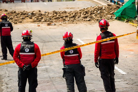 Quito, Ecuador - December 09, 2016: An unidentified group of happy firefighters team with equipment in the streetsのeditorial素材