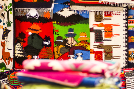 OTAVALO, ECUADOR - MAY 17, 2017: Beautiful andean traditional clothing textile yarn and woven by hand in wool, colorful fabrics backgroundのeditorial素材