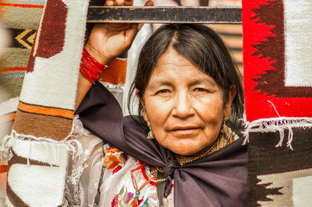 OTAVALO, ECUADOR - MAY 17, 2017: Close up of an unidentified hispanic indigenous woman wearing andean traditional clothing, posing for cameraのeditorial素材