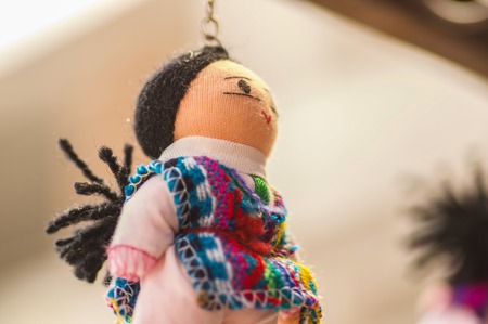 OTAVALO, ECUADOR - MAY 17, 2017: Beautiful andean toy textile yarn and woven by hand in wool, in white backgroundのeditorial素材