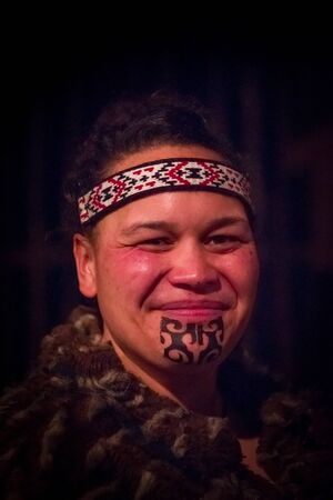 NORTH ISLAND, NEW ZEALAND- MAY 17, 2017: Portrait of Tamaki Maori man with traditionally tatooed face in traditional dress at Maori Culture, Tamaki Cultural Village, Rotorua, New Zealandのeditorial素材