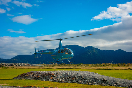 SOUTH ISLAND, NEW ZEALAND- MAY 25, 2017: A helicopter lifting off ready to take tourists to a glacier in the South Island of New Zealandのeditorial素材