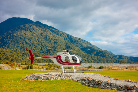 SOUTH ISLAND, NEW ZEALAND- MAY 25, 2017: A helicopter ready to take tourists to a glacier in the South Island of New Zealandのeditorial素材