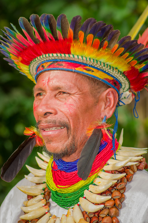 LAGO AGRIO, ECUADOR - NOVEMBER 17, 2016: Portrait of a Siona shaman in traditional dress with a feather hat in an indigenous village in the Cuyabeno Wildlife Reserveのeditorial素材