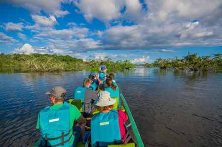 CUYABENO, ECUADOR - NOVEMBER 16, 2016: Unidentified people travelling by boat into the depth of Amazon Jungle in Cuyabeno National Park, Ecuadorのeditorial素材