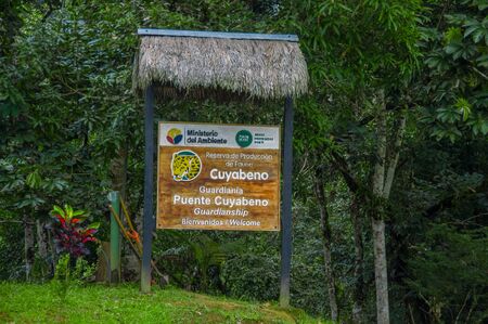 CUYABENO, ECUADOR - NOVEMBER 16, 2016: An informative wooden sign about the Cuyabeno National Park, depth of Amazon Jungle, in Ecuadorのeditorial素材