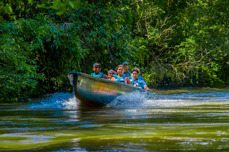 CUYABENO, ECUADOR - NOVEMBER 16, 2016: Unidentified people travelling by boat into the depth of Amazon Jungle in Cuyabeno National Park, Ecuadorのeditorial素材