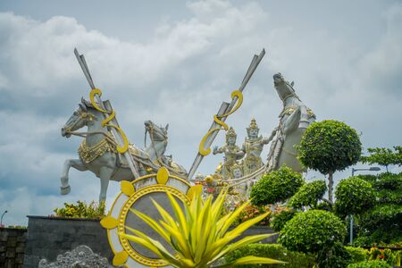 BALI, INDONESIA - MARCH 08, 2017: A beautiful hindu statue in the enter of market in the city of Denpasar in Indonesiaのeditorial素材