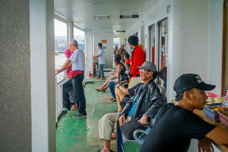 BALI, INDONESIA - APRIL 05, 2017: An unidentified people enjying the beautiful view from the ferry...