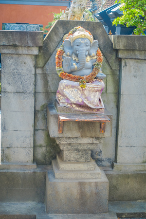 BALI, INDONESIA - APRIL 05, 2017: Beautiful stone statue in Ubud temple in Bali, Indonesiaのeditorial素材