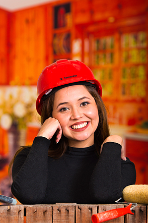 Beautiful young female painter with a brushの写真素材