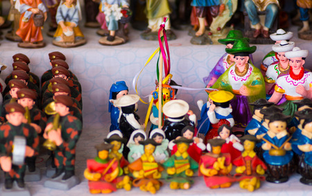 QUITO, ECUADOR- 07 MAY, 2017: Beautiful small figures made of clay over a white tableのeditorial素材