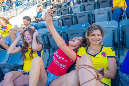 NEW YORK, USA - NOVEMBER 22, 2016: Unidentified ecuadorian women fans in Metlife Stadium, ready to...