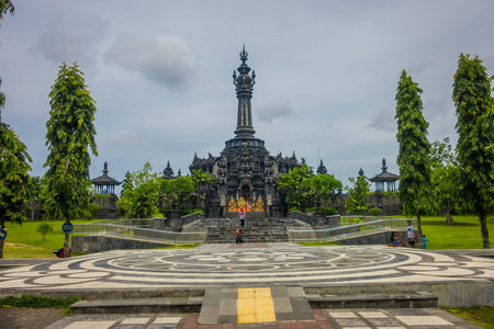BALI, INDONESIA - MARCH 08, 2017: Panoramic landscape traditional balinese hindu temple Bajra Sandhi monument in Denpasar, Bali, Indonesia on background tropical nature and blue summer sky, Indonesiaのeditorial素材