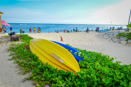 BALI, INDONESIA - MARCH 11, 2017: Beautiful sunny day with two boats over a plants in a white sand, in the beach of Pantai pandawa, in Bali island, Indonesiaのeditorial素材