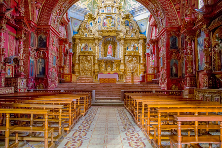 QUITO, ECUADOR - NOVEMBER 23, 2016: Interior of the Church of Santo Domingo, with chairs an spiritual imagesのeditorial素材