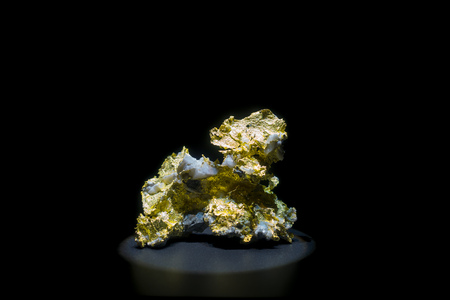 Stone with gold around his structure at National Museum of Natural Science in Orlando Houston in USA, in a black backgroundの写真素材